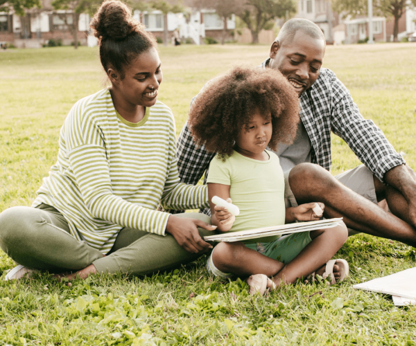 Step-Parenting with family of three in grass