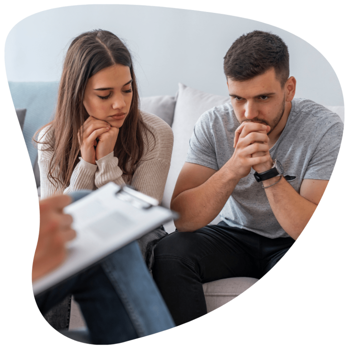 Pensive looking couple in counseling