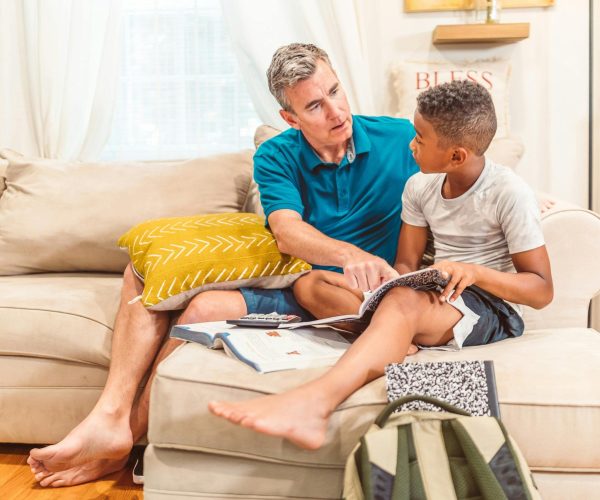 dad and son talking on couch